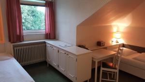 Postel nebo postele na pokoji v ubytování Hotel Hohenstauffen
