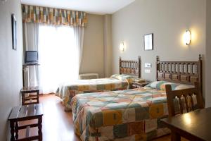 Postel nebo postele na pokoji v ubytování Hotel Casa Aurelia