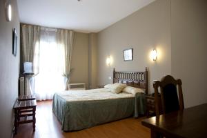 Postel nebo postele na pokoji v ubytování Hotel Casa Aurelia