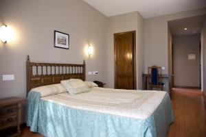 Postel nebo postele na pokoji v ubytování Hotel Casa Aurelia