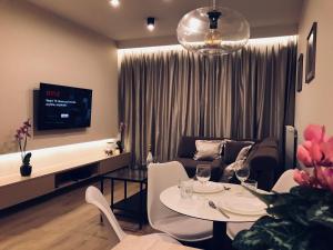 a living room with a table and a couch at Mariacka Old Town Apartments in Szczecin