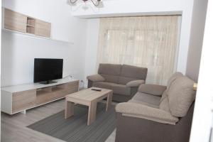 Televízia a/alebo spoločenská miestnosť v ubytovaní El Apartamento de María