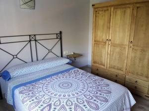 Postel nebo postele na pokoji v ubytování Cortijo de los geraneos