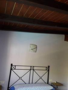 Postel nebo postele na pokoji v ubytování Cortijo de los geraneos