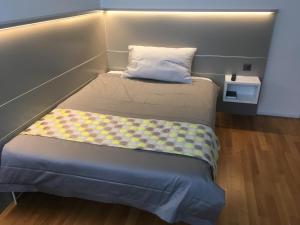 
Ein Bett oder Betten in einem Zimmer der Unterkunft Hotel Flawil
