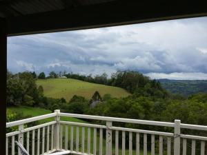 a balcony with a view of a green field at Montville House on the Hill in Montville