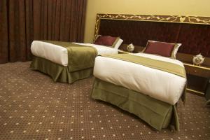Ein Bett oder Betten in einem Zimmer der Unterkunft MB Deluxe Hotel
