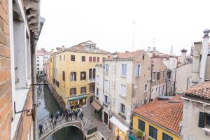 a view of a canal in a city with buildings at Residence SanMarco in Venice