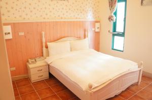 Postel nebo postele na pokoji v ubytování Rainbow B&B