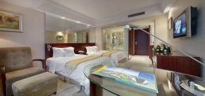 Ein Bett oder Betten in einem Zimmer der Unterkunft President Hotel