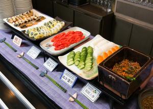 a buffet with different types of food on a table at Aizuwakamatsu Washington Hotel in Aizuwakamatsu