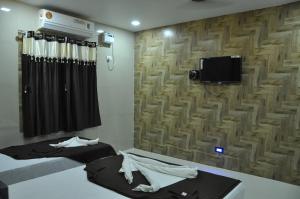 TV a/nebo společenská místnost v ubytování Hotel SAARA