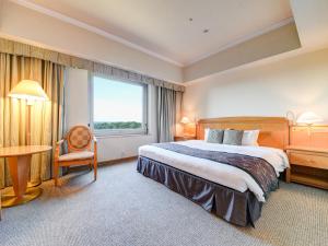 Кровать или кровати в номере Forest Inn Showakan (Okura Hotels & Resorts)
