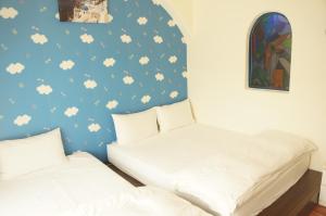 Postel nebo postele na pokoji v ubytování Rainbow B&B