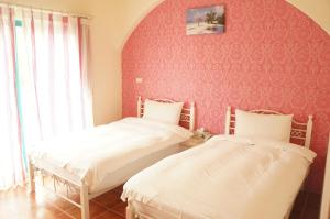 Postel nebo postele na pokoji v ubytování Rainbow B&B