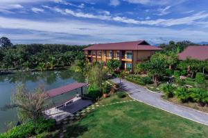 an aerial view of a resort with a lake at Tamali Hotel in Nakhon Si Thammarat