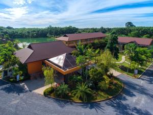 an aerial view of a resort with a lake at Tamali Hotel in Nakhon Si Thammarat