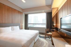 Katil atau katil-katil dalam bilik di Home Hotel