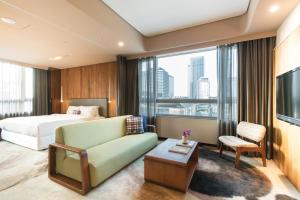 Televisyen dan/atau pusat hiburan di Home Hotel