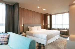 Katil atau katil-katil dalam bilik di Home Hotel