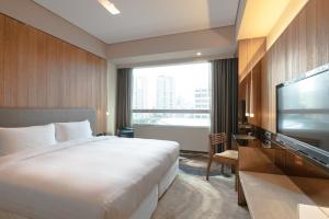 Katil atau katil-katil dalam bilik di Home Hotel