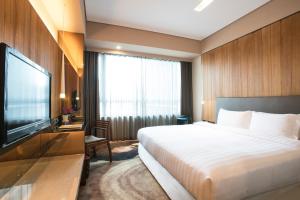 Katil atau katil-katil dalam bilik di Home Hotel