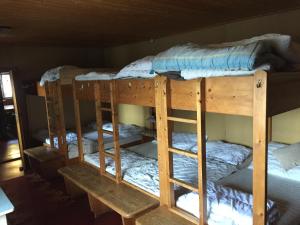 A bed or beds in a room at Zettlerhütte Planneralm