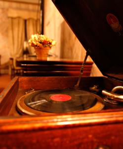 a close up of a record player with a cd at Hotel Locanda Di Bagnara in Bagnara di Romagna
