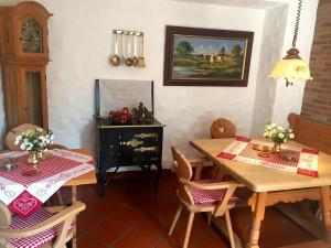 a dining room with two wooden tables and chairs at Hotel Gastgeb in Essen