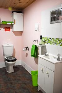 a bathroom with a toilet and a sink at Avoca Park Equestrian Farmstay in Macclesfield