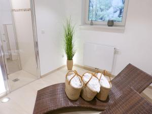 a pair of baskets sitting on a table in a bathroom at Heidehüs Seepferdchen in Nebel +35 photos