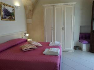 Posteľ alebo postele v izbe v ubytovaní B&B Demetra