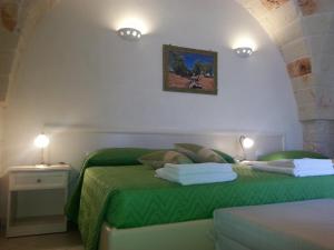 Posteľ alebo postele v izbe v ubytovaní B&B Demetra