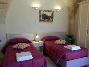 Posteľ alebo postele v izbe v ubytovaní B&B Demetra