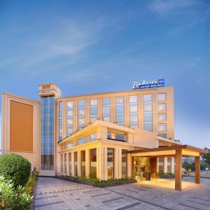 a rendering of a hotel with a building at Radisson Blu Jammu in Jammu