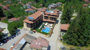 an aerial view of a large house with a swimming pool at Hotel Center in Apriltsi