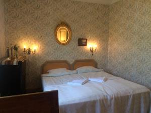 Ένα ή περισσότερα κρεβάτια σε δωμάτιο στο Guesthouse Enigheten