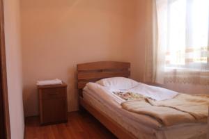 Postel nebo postele na pokoji v ubytování Hotel Restaurant Kakhaberi