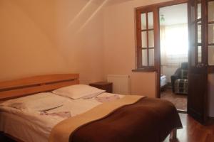 Postel nebo postele na pokoji v ubytování Hotel Restaurant Kakhaberi