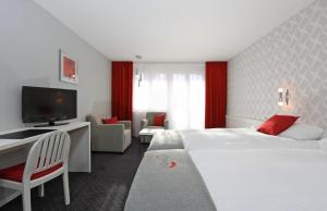 Postel nebo postele na pokoji v ubytování Hotel Steinmattli