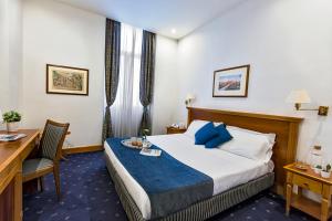 מיטה או מיטות בחדר ב-Hotel Diplomatic