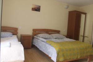Postel nebo postele na pokoji v ubytování Hotel Restaurant Kakhaberi