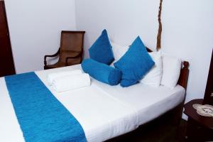 En eller flere senge i et værelse på Bethel Rest Homestay