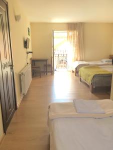 Postel nebo postele na pokoji v ubytování Hotel Restaurant Kakhaberi