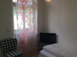 Postel nebo postele na pokoji v ubytování Hotel Heidelberg Astoria