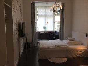 Postel nebo postele na pokoji v ubytování Hotel Heidelberg Astoria