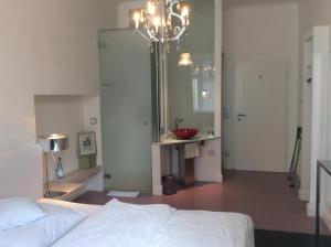 Postel nebo postele na pokoji v ubytování Hotel Heidelberg Astoria