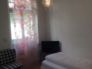 Postel nebo postele na pokoji v ubytování Hotel Heidelberg Astoria