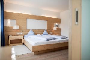 Voodi või voodid majutusasutuse Alpine Hotel Ciasa Lara toas