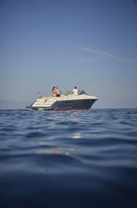 a boat in the water with people on it at Splendido, A Belmond Hotel, Portofino in Portofino